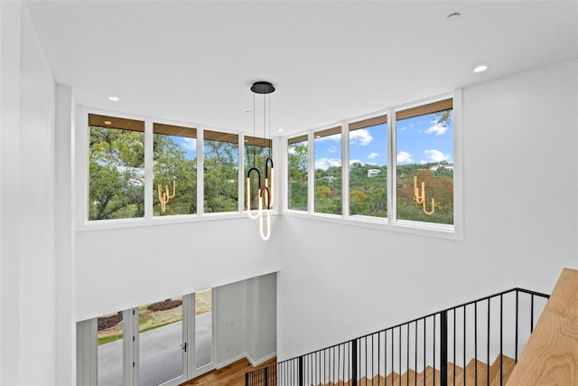 2206 Trail Of The Madrones, Austin, TX 78746 - stairs featuring a wealth of natural light and hardwood / wood-style floors