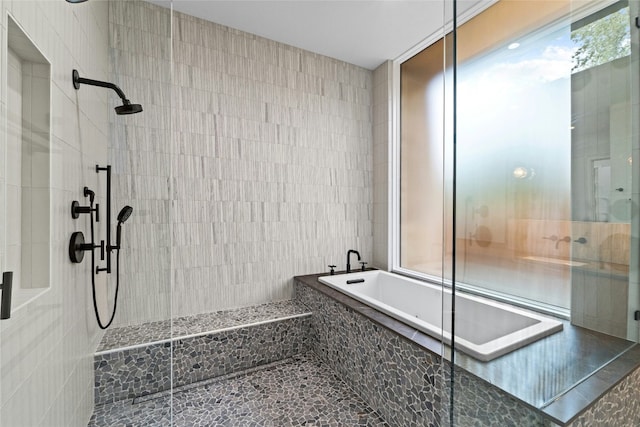 2206 Trail Of The Madrones, Austin, TX 78746 - bathroom featuring tile walls and independent shower and bath