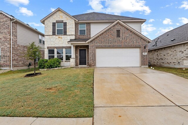 view of property with a garage and a front yard