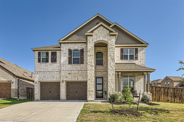 view of front of house with a garage and a front yard