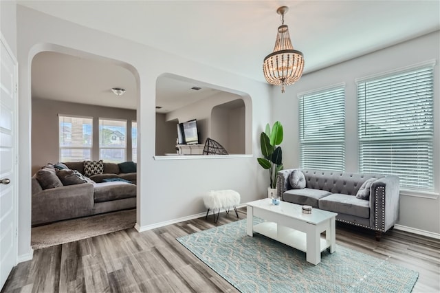 living room featuring hardwood / wood-style floors and a chandelier