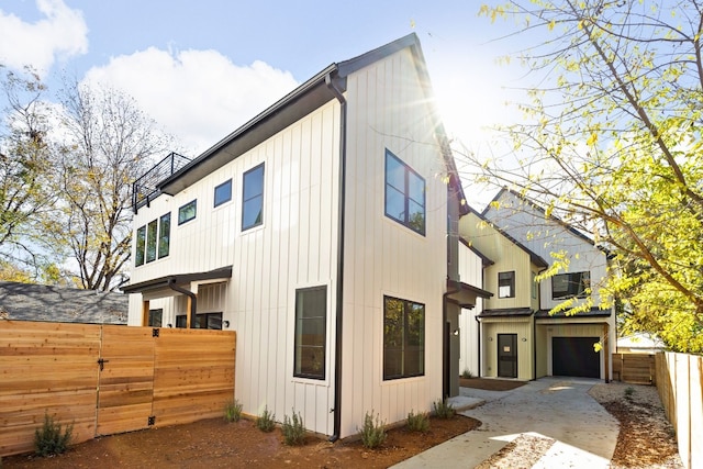 view of side of property with a garage