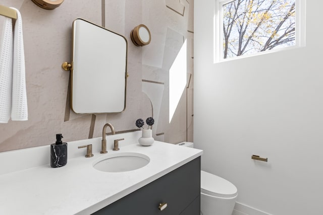 bathroom with vanity and toilet