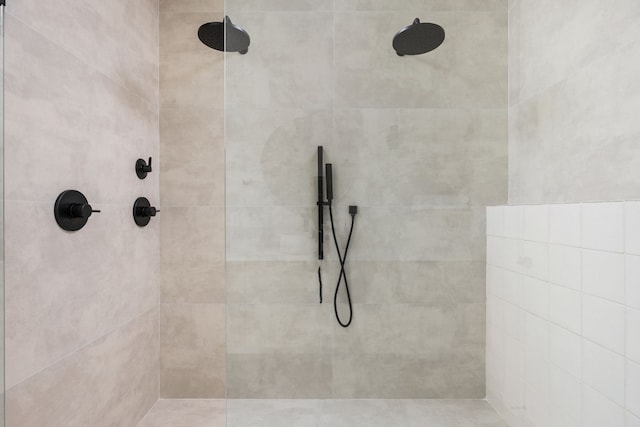 bathroom with tiled shower