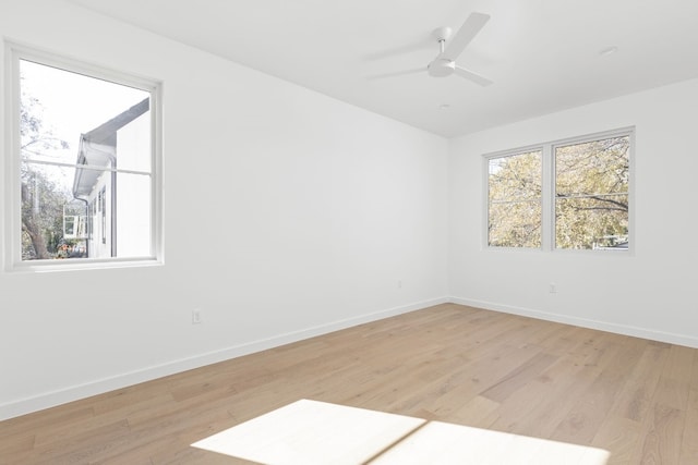 unfurnished room with light hardwood / wood-style flooring and ceiling fan