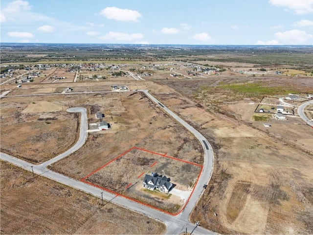 birds eye view of property featuring a rural view