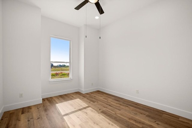 unfurnished room with ceiling fan and light hardwood / wood-style flooring