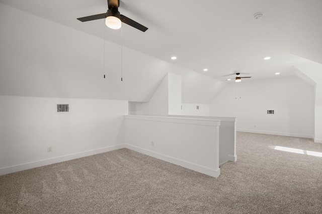 bonus room with carpet, ceiling fan, and lofted ceiling