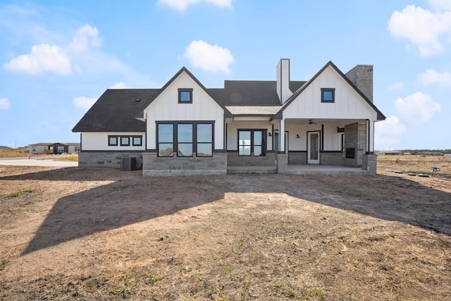 back of property featuring ceiling fan, cooling unit, and covered porch