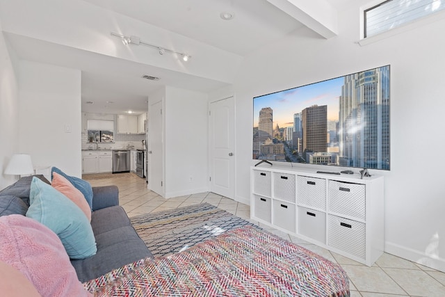 living room featuring light tile patterned floors and sink