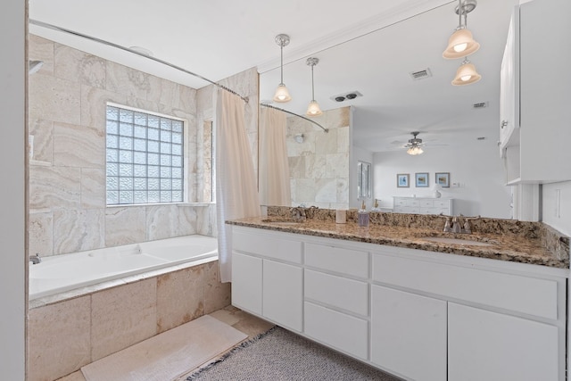 bathroom featuring vanity, tile patterned flooring, ceiling fan, shower / bath combo with shower curtain, and tile walls