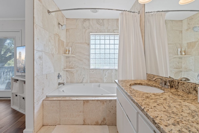 bathroom with vanity, hardwood / wood-style flooring, crown molding, and shower / bath combo with shower curtain