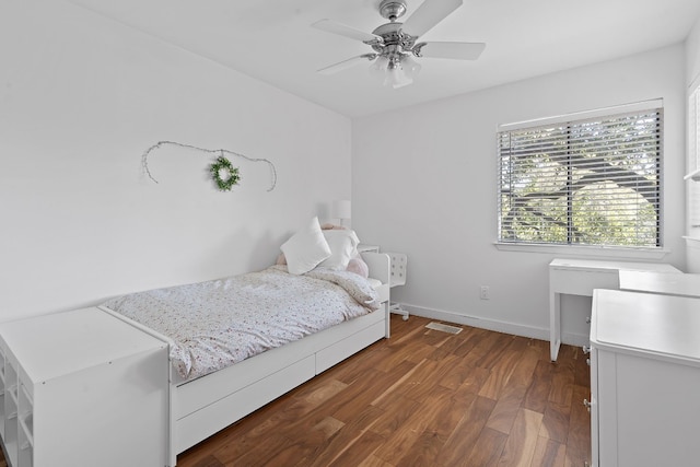 bedroom featuring ceiling fan and dark hardwood / wood-style flooring