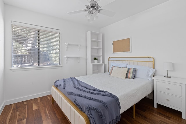 bedroom featuring dark hardwood / wood-style floors and ceiling fan