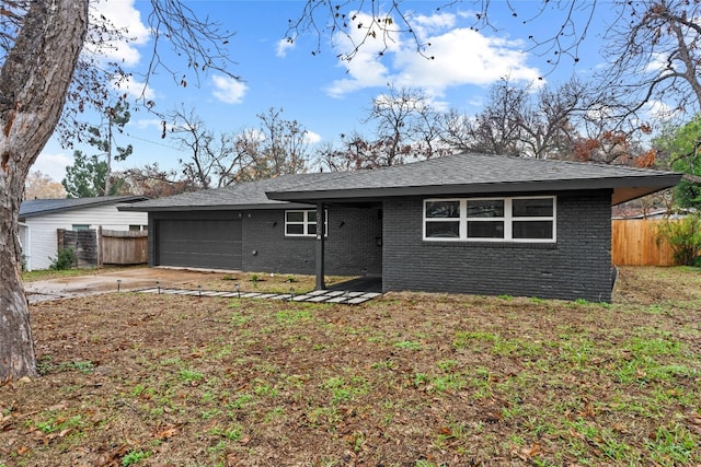 single story home featuring a garage