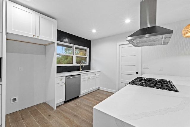 kitchen featuring white cabinetry, sink, light hardwood / wood-style flooring, stainless steel dishwasher, and island exhaust hood