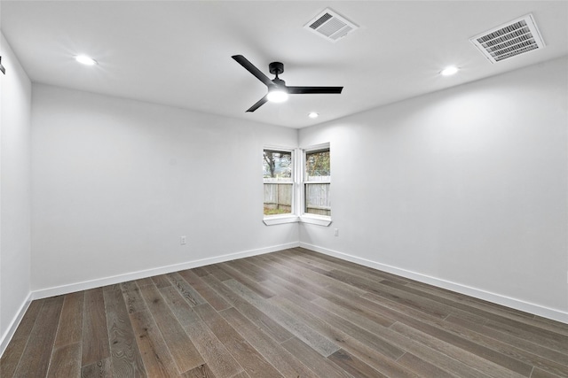 unfurnished room featuring dark hardwood / wood-style flooring and ceiling fan