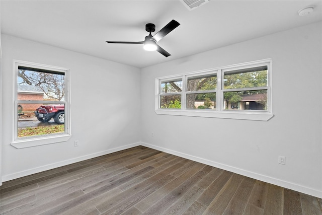 unfurnished room with hardwood / wood-style floors and ceiling fan