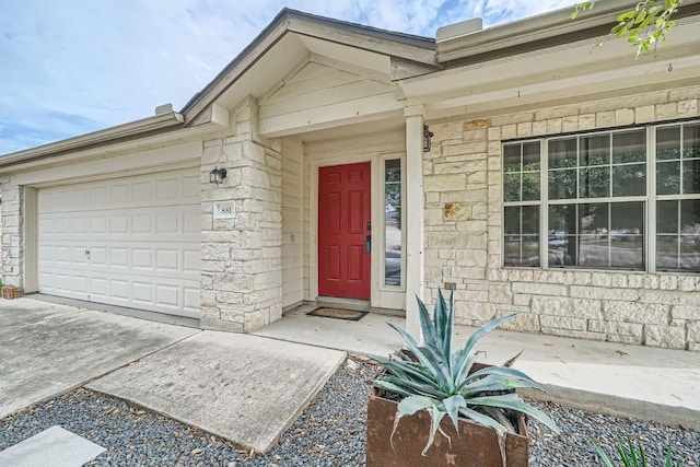 doorway to property featuring a garage