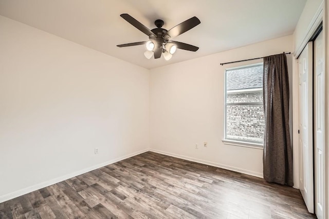 empty room featuring ceiling fan and wood-type flooring