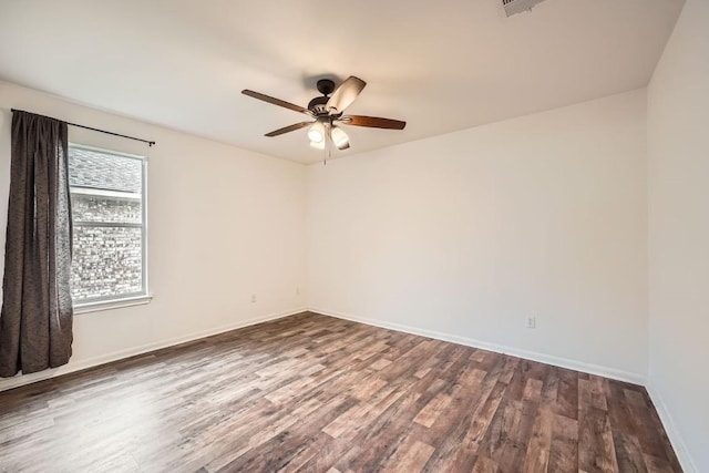 unfurnished room featuring dark hardwood / wood-style floors and ceiling fan