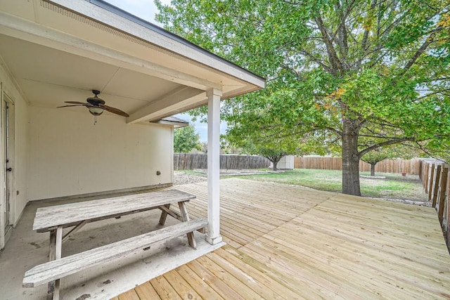 deck with ceiling fan and a storage shed