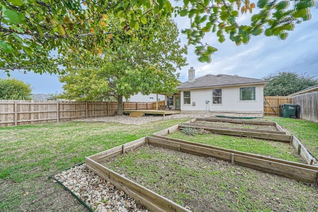 view of yard with a deck