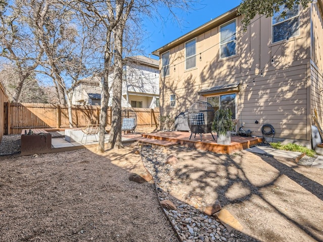 rear view of house with a deck and a patio