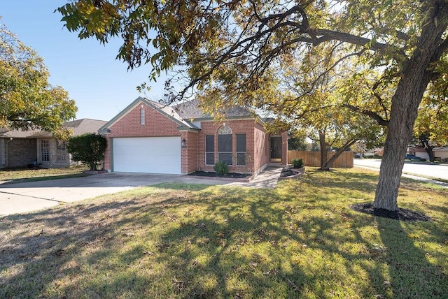 view of front of house featuring a front lawn and a garage