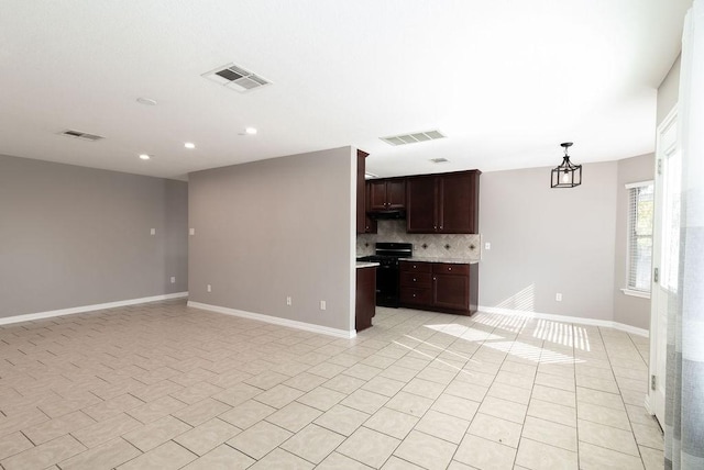 interior space with light tile patterned flooring and a notable chandelier