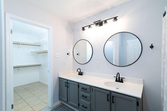 bathroom with tile patterned flooring and vanity