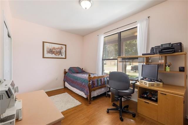 bedroom with light wood-type flooring