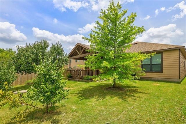 view of yard featuring a wooden deck