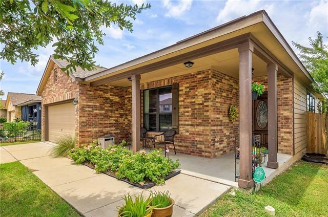 view of home's exterior featuring a porch and a garage