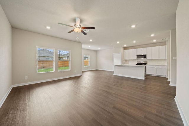 236 Lazy Lizzy Rd, Jarrell, TX 76537 - unfurnished living room featuring a ceiling fan, recessed lighting, baseboards, and dark wood-type flooring
