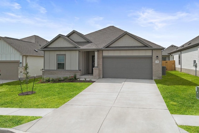 236 Lazy Lizzy Rd, Jarrell, TX 76537 - view of front of house with board and batten siding, a garage, concrete driveway, and a shingled roof