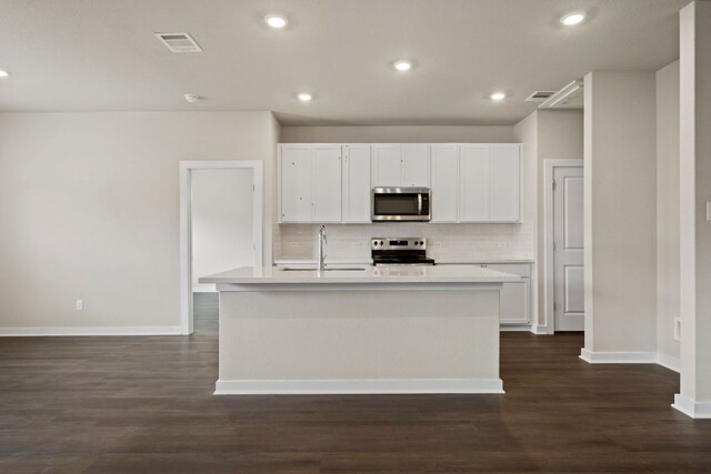 236 Lazy Lizzy Rd, Jarrell, TX 76537 - kitchen featuring appliances with stainless steel finishes, a sink, backsplash, white cabinetry, and recessed lighting