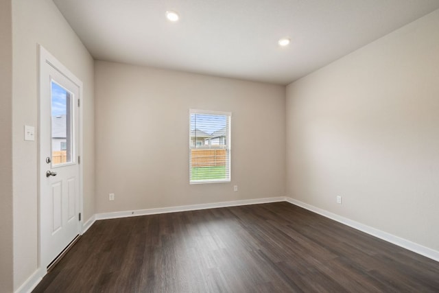 236 Lazy Lizzy Rd, Jarrell, TX 76537 - spare room featuring dark wood-style flooring, plenty of natural light, baseboards, and recessed lighting