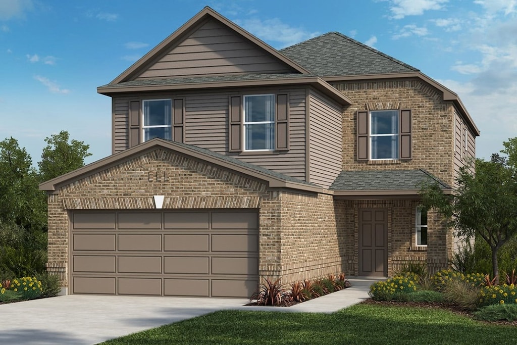 view of front of house with a garage and a front lawn