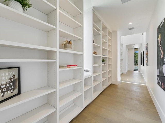 corridor featuring light hardwood / wood-style flooring