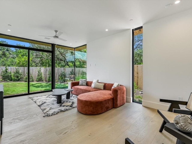 sunroom with plenty of natural light and ceiling fan