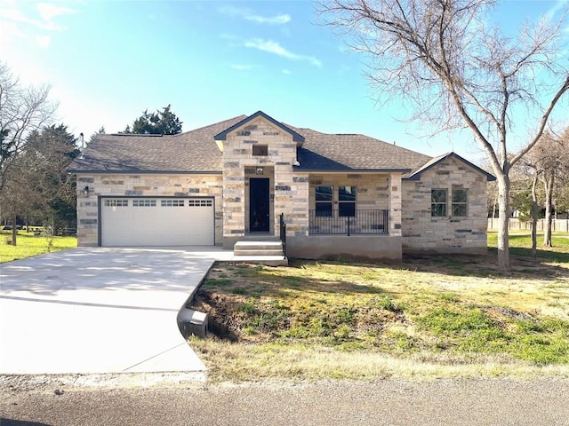 view of front of house with a front yard and a garage