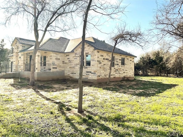 view of home's exterior with a lawn