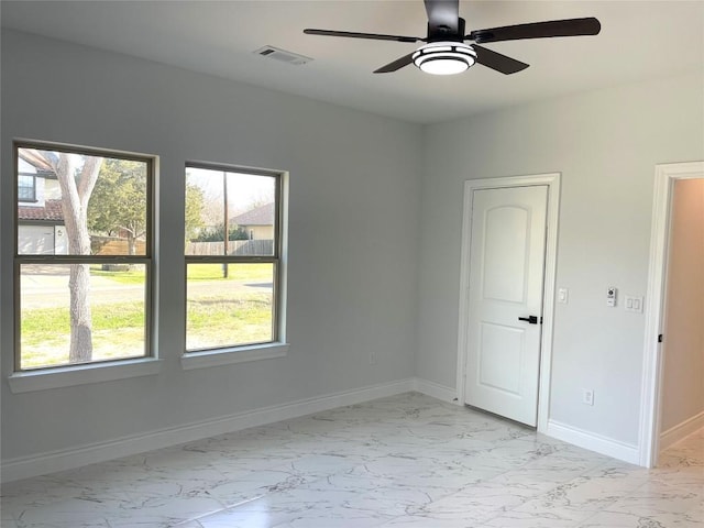 spare room with ceiling fan