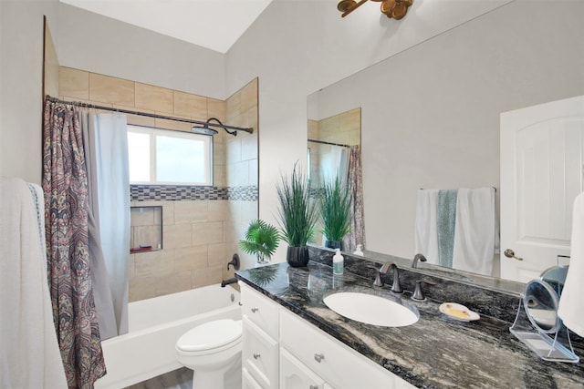 full bathroom featuring vanity, toilet, and shower / tub combo