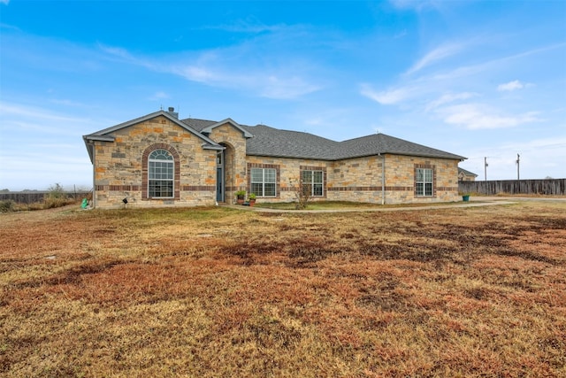 ranch-style house with a front yard