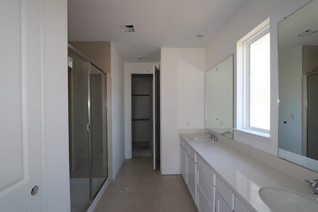 bathroom featuring vanity and walk in shower