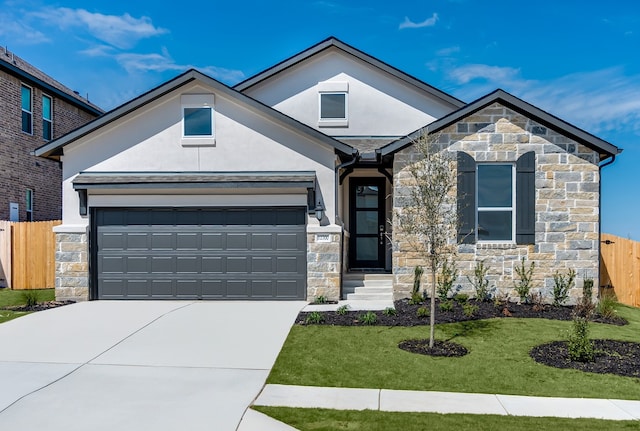 view of front facade featuring an attached garage, fence, stucco siding, stone siding, and driveway