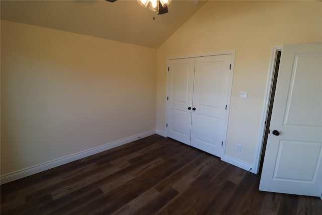 unfurnished bedroom with ceiling fan, dark hardwood / wood-style flooring, and high vaulted ceiling