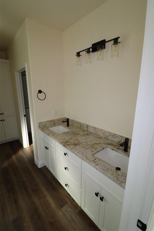 bathroom with hardwood / wood-style floors and vanity